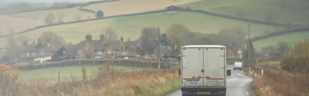 Removals van driving through Hampshire countryside towards Alton